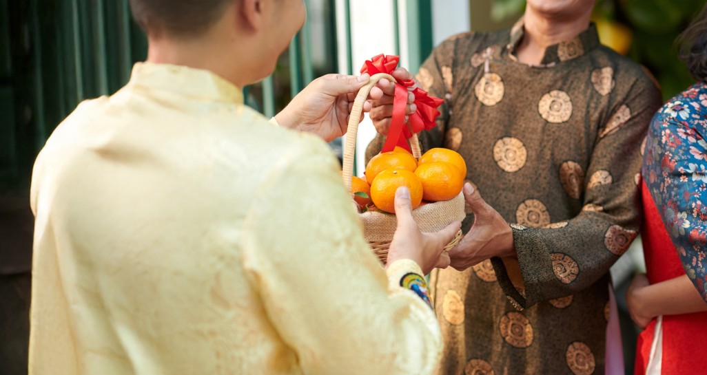 man giving basket ripe mandarins his senior dad when he is visiting lunar new year celebra copy v2